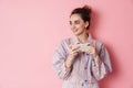 Image of ginger smiling woman playing video game on cellphone Royalty Free Stock Photo