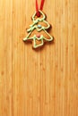 Image of gingerbread Christmas tree cookie over wooden texture Royalty Free Stock Photo