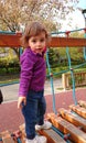 Little girl climbing on a wood bridge. Royalty Free Stock Photo