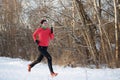 Image of girl in sports uniform on morning run in winter Royalty Free Stock Photo