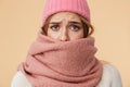 Image of girl wearing winter hat and scarf frowning and being upset Royalty Free Stock Photo