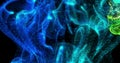 Image of glowing blue and green particle vapours moving on black background