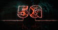 Image of glowing orange 5g text over blue processor socket Royalty Free Stock Photo