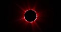Image of glowing red circle eclipse over black background Royalty Free Stock Photo