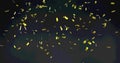 Image of gold confetti floating over black background