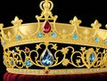 A gold crown with intricate details and gems.