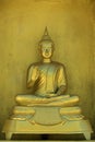 Image of golden buddha statue in temple in province tak.
