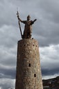 Image of a golden Inca's sculpture in a monument. Traditional icon in Cusco Peru Royalty Free Stock Photo