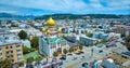 Gorgeous aerial of Holy Virgin Cathedral with Golden Gate Bridge in background