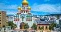 Gorgeous summer day with blue sky and white clouds over entrance to Holy Virgin Cathedral aerial