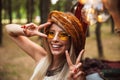 Image of gorgeous woman, wearing stylish accessories smiling and Royalty Free Stock Photo