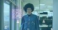 Image of gr code and icons over biracial woman smiling in office Royalty Free Stock Photo