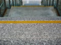 Image of granite stairs with yellow line markers Royalty Free Stock Photo