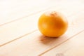 Image of grapefruit on wooden background with copyspace