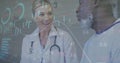 Image of graphs, loading circles and trading board, diverse female doctor talking with patient Royalty Free Stock Photo