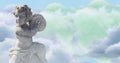 Image of gray sculpture of cupid over blue sky and clouds, copy space