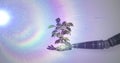 Image of growing plant in hand of robot arm, with prismatic light on grey background Royalty Free Stock Photo