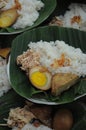 Gudeg rice with skewed chicken and salted eggs