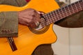 Image of a guitar player, without identifying the face