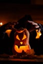 Image of halloween pumpkin cut in shape of face with witch Royalty Free Stock Photo