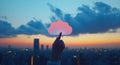 An image of a hand grasping a cloud technology icon, set against a cityscape with a luminous effect, symbolizing digital Royalty Free Stock Photo