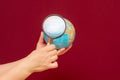 Image of a hand holding a magnifying glass over an world globe Royalty Free Stock Photo