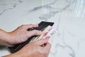 Image hand of a man picks up money pound from the wallet