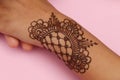 Image of hand painted on henna mehendi tattoo. Indian Mehendi celebration. Henna application and rituals. Indian bride and Royalty Free Stock Photo