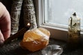 Orange Calcite Crystal and Burning Smudge Sticks