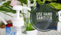 Image of hand sanitizer plastic bottle with wordings `use hand sanitizer, avoid covid-19`