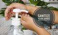 Image of  hand sanitizer usage with wordings `sanitize your hands` Royalty Free Stock Photo