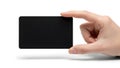 A hand holding a blank black rectangular object against a white background Royalty Free Stock Photo