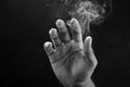 Image of a hand  and smoke Royalty Free Stock Photo