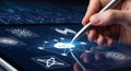 Hand using a stylus to draw a glowing symbol on a digital tablet. Royalty Free Stock Photo