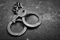 image of handcuffs key asphalt background Royalty Free Stock Photo