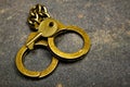 image of handcuffs key asphalt background Royalty Free Stock Photo