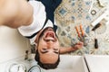 Optimistic young man plumber work in uniform Royalty Free Stock Photo