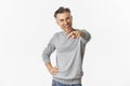 Image of handsome middle-aged man smiling and pointing finger at camera, need you, found candidate, standing over white Royalty Free Stock Photo