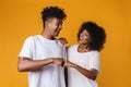 Image of happy african american couple smiling and giving fist bump Royalty Free Stock Photo