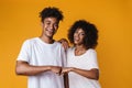 Image of happy african american couple smiling and giving fist bump Royalty Free Stock Photo