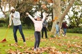 Image of happy african american multi generation family having fun in autumn garden Royalty Free Stock Photo