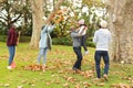 Image of happy african american multi generation family having fun in autumn garden Royalty Free Stock Photo