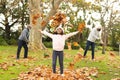 Image of happy african american multi generation family having fun in autumn garden Royalty Free Stock Photo