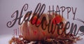 Image of happy halloween trick or treat text with spider over carved pumpkin lantern