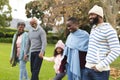 Image of happy multi generation african american family having fun outdoors in autumn Royalty Free Stock Photo