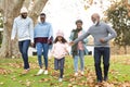 Image of happy multi generation african american family having fun outdoors in autumn Royalty Free Stock Photo