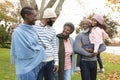 Image of happy multi generation african american family having fun outdoors in autumn Royalty Free Stock Photo