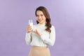 Image of happy positive optimistic young beautiful woman posing  holding milk Royalty Free Stock Photo