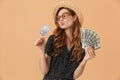 Image of happy rich woman 20s wearing straw hat and sunglasses h