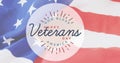 Image of happy veterans day text over american flag Royalty Free Stock Photo